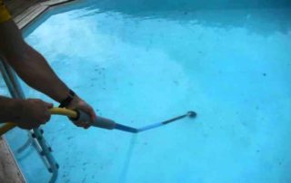 remove dirt from the bottom of the pool